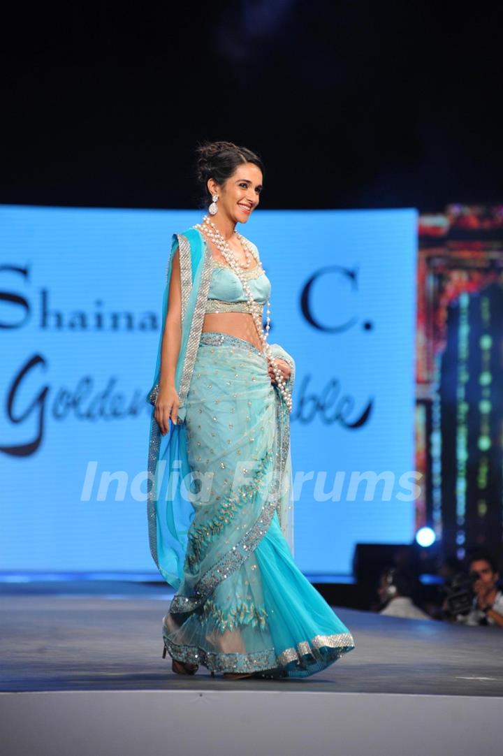 Tara Sharma walks the ramp at the 'Caring with Style' fashion show at NSCI