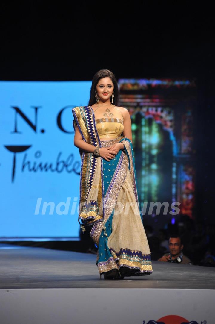 Rashmi Desai walks the ramp at the 'Caring with Style' fashion show at NSCI