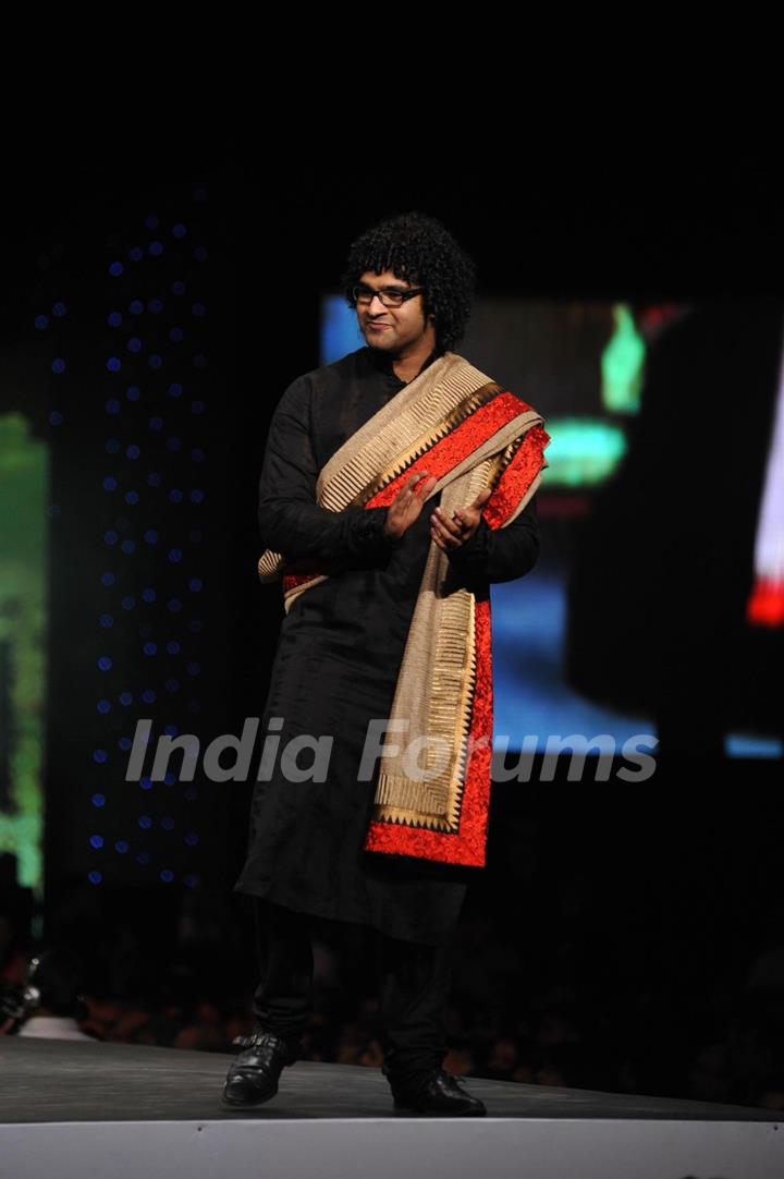 Siddharth Mahadevan walks the ramp at the 'Caring with Style' fashion show at NSCI