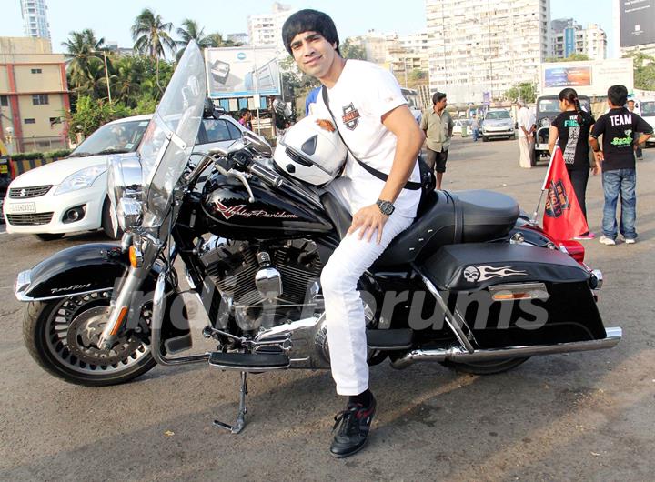 Arfi Lamba poses with a bike at The Fugly Bike Rally