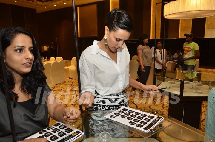 Neha Dhupia browse through the various jeweler designs