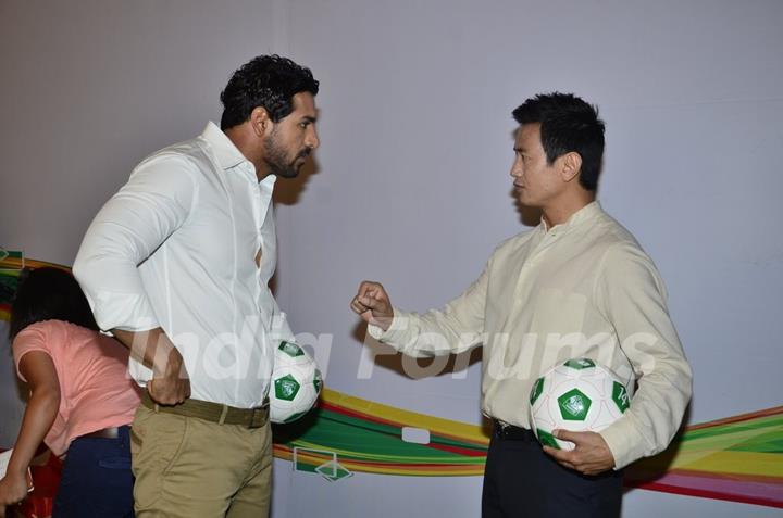 John Abraham talking to Baichung Bhutia at Castrol Photo Shoot