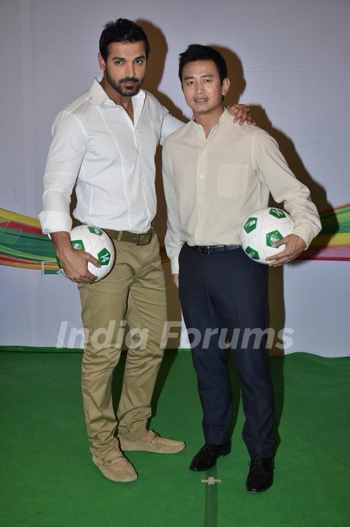 John Abraham clicks a pic with Baichung Bhutia at Castrol Photo Shoot