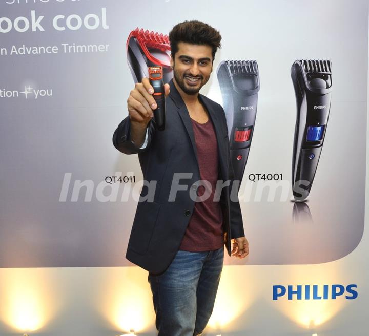 Arjun Kapoor poses with male grooming gadget