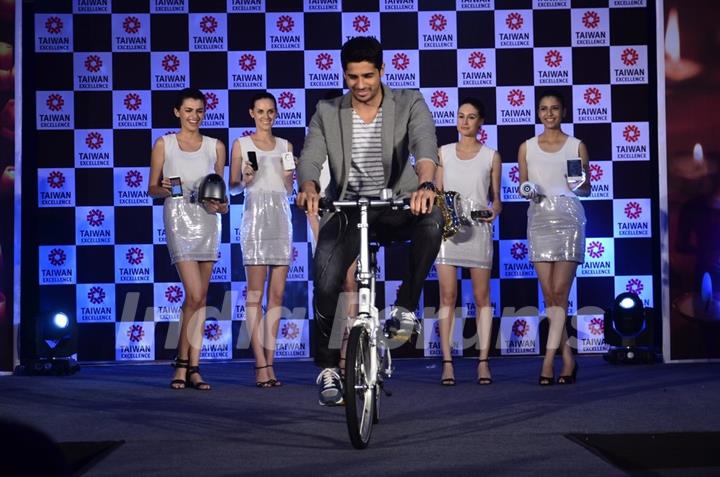 Sidharth Malhotra riding the bicycle at Taiwan Excellence launch