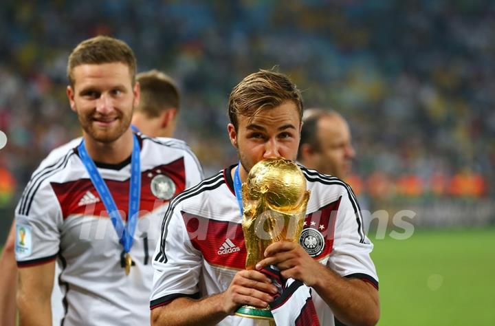 Mario Gotze kissing the Trophy at the FIFA Finale