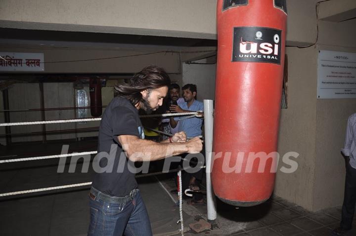 Akhil Kapur practices few punches on a punching bag at the Promotions of Desi Kattey