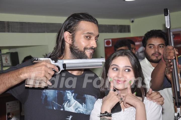 Akhil Kapur and Sasha Agha pose with a gun at the Promotions of Desi Kattey