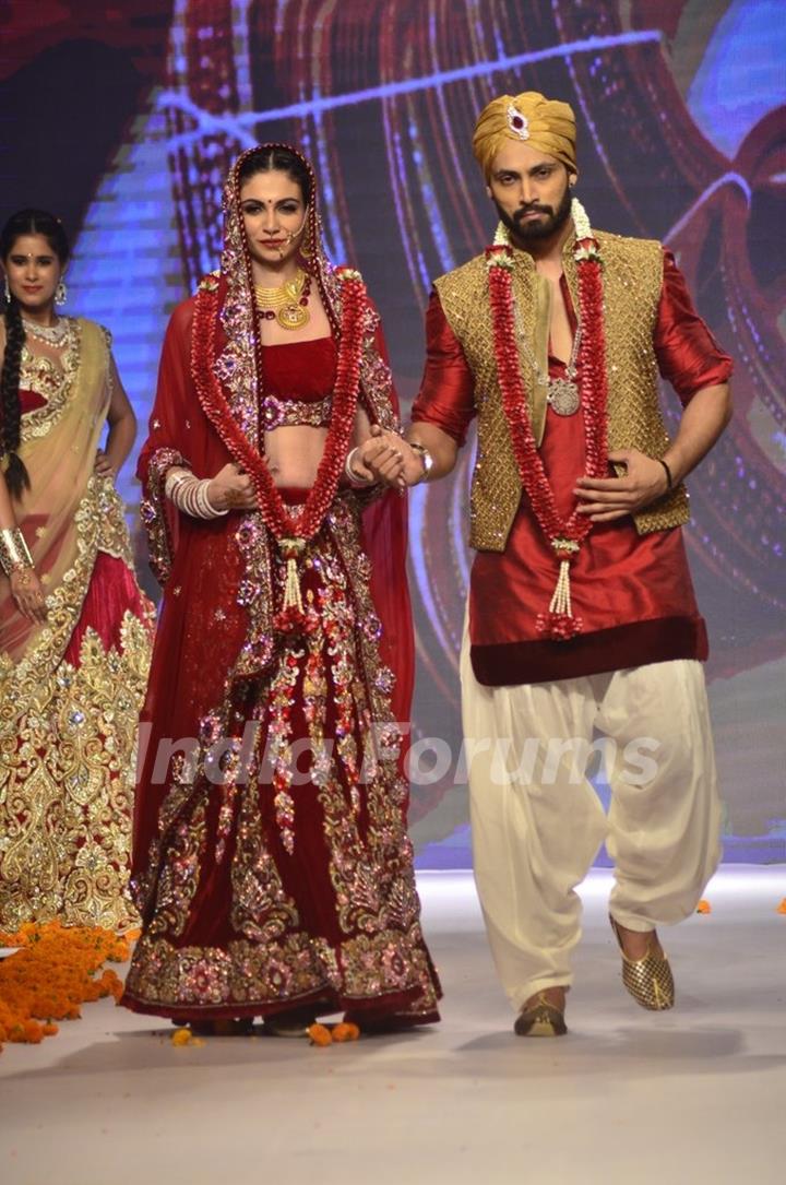 A bride and a groom walk the ramp at the IIJW 2014 - Day 2