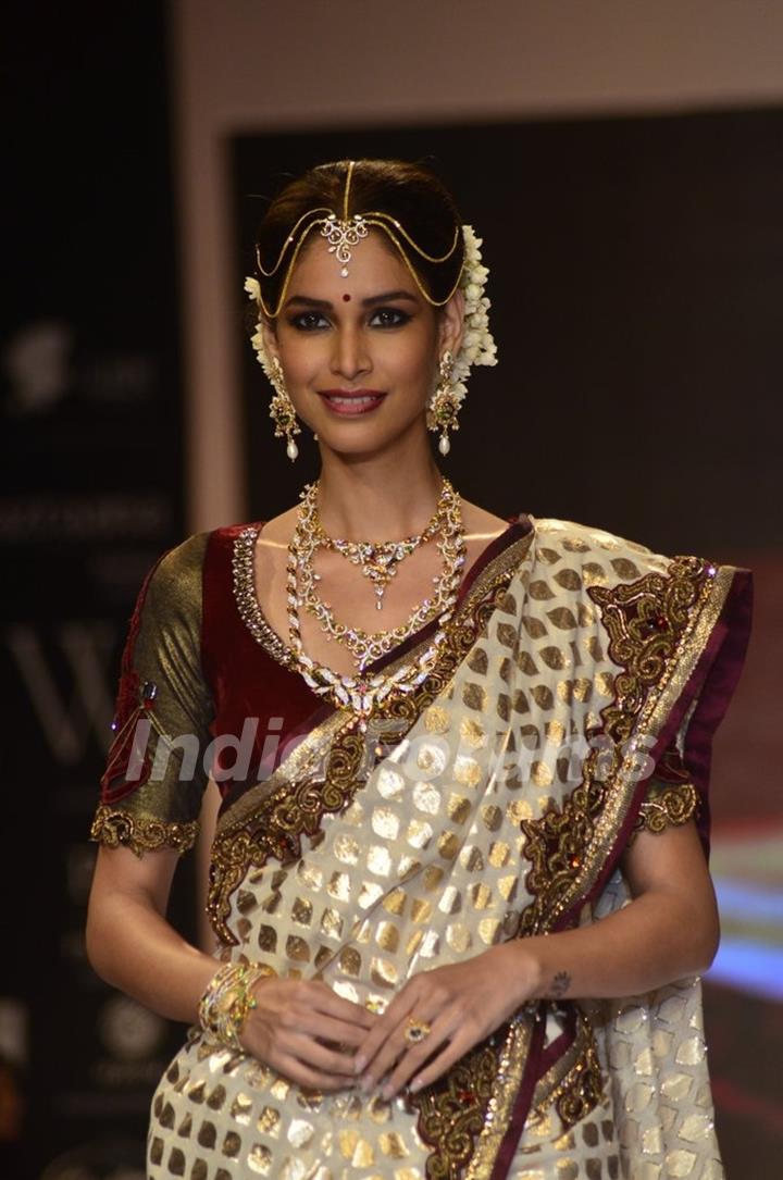 A model walks the ramp as a South India bride at the IIJW 2014 - Day 2