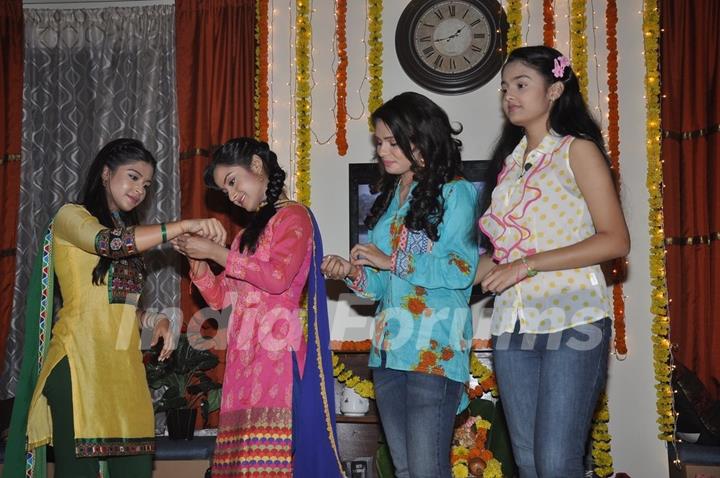 Ishita Ganguly ties the sacred thread to Neha Pednekar at the Launch of Shastri Sisters