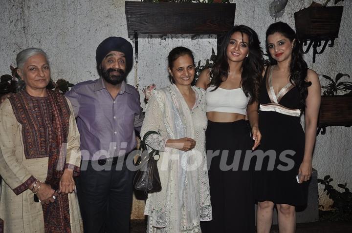 Surveen Chawla poses with family at the Screening of Hate Story 2