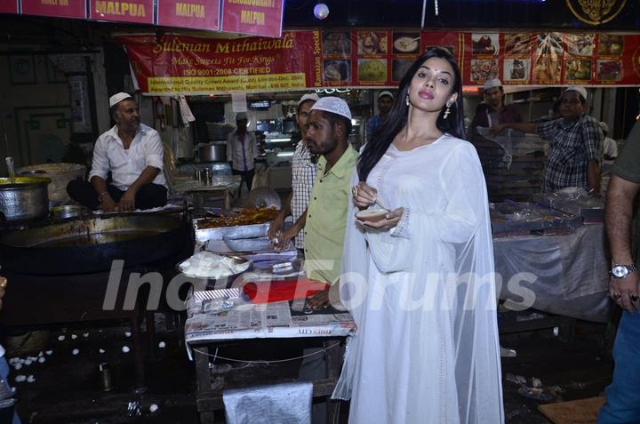 Sara Loren enjoys some sweets at Minara Masjid