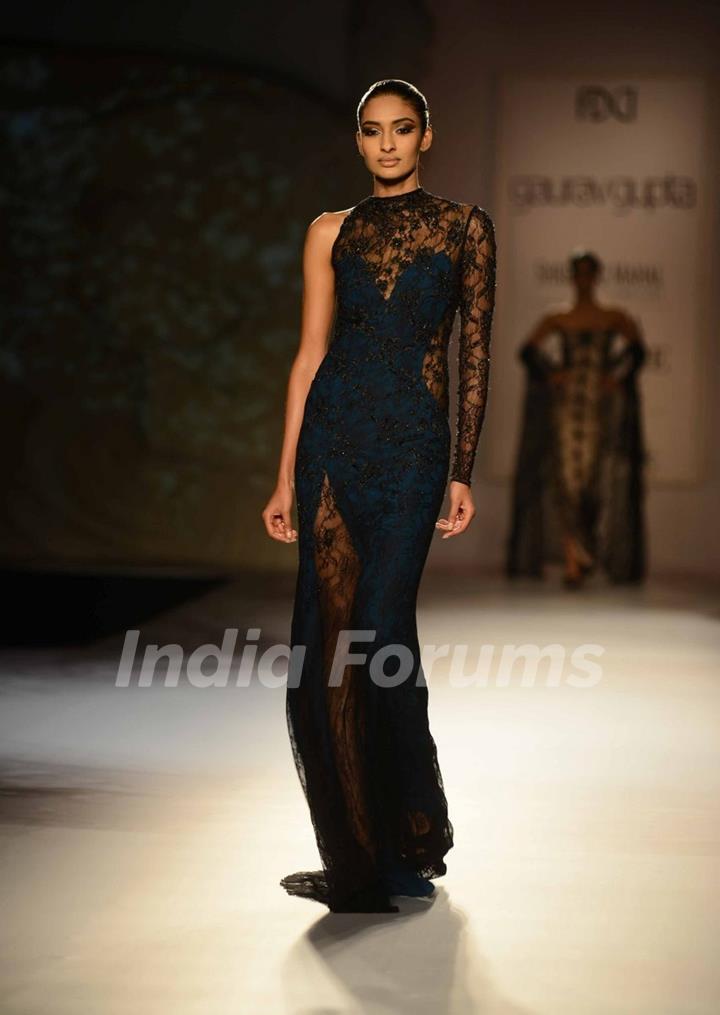 A model walks the ramp at the Indian Couture Week - Day 4