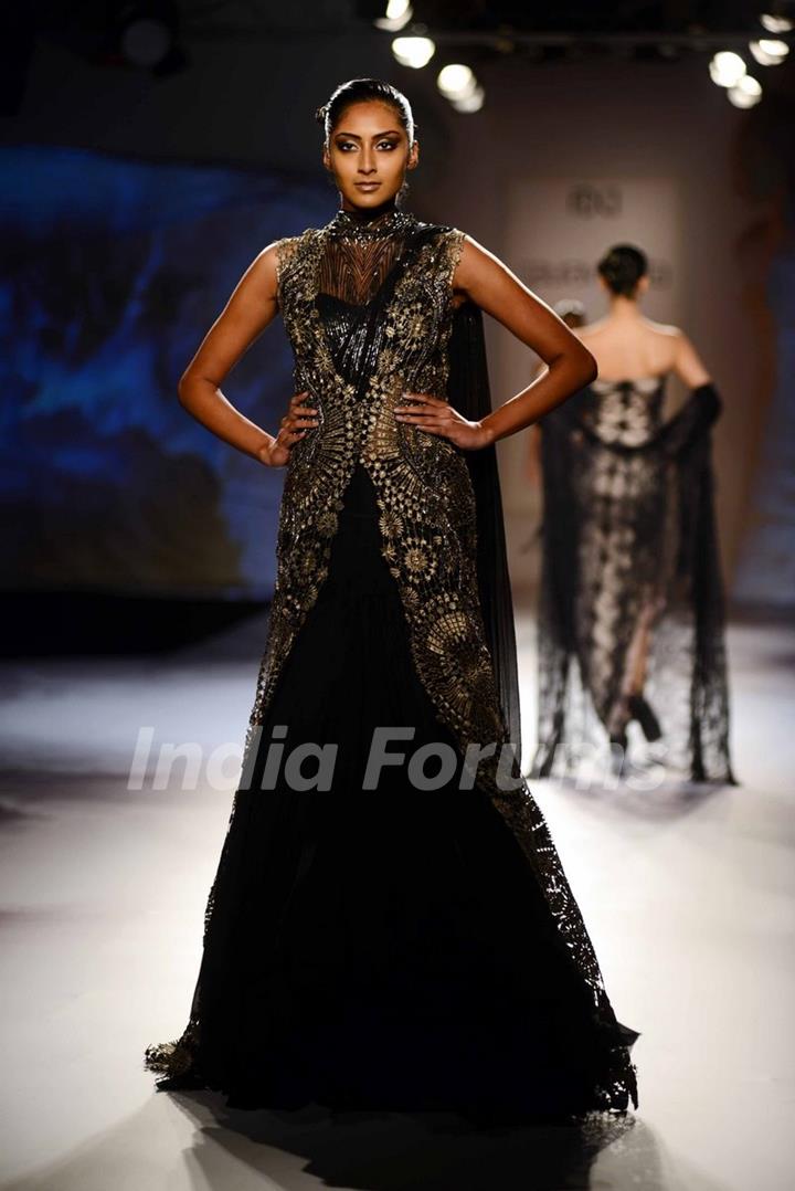 A model walks the ramp at the Indian Couture Week - Day 4