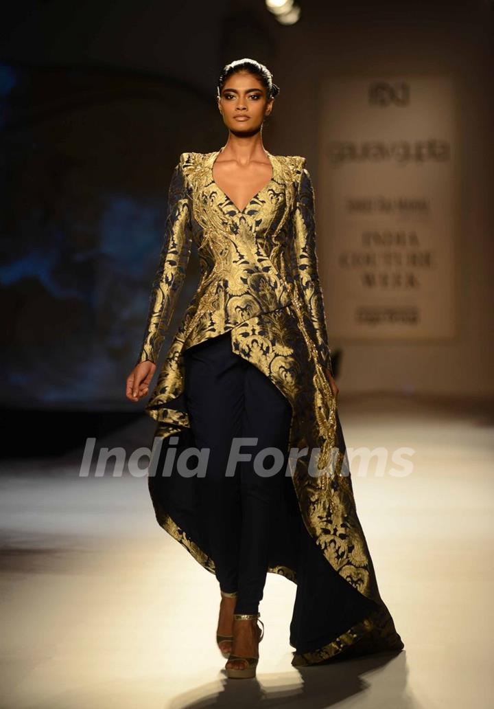 A model walks the ramp at the Indian Couture Week - Day 4