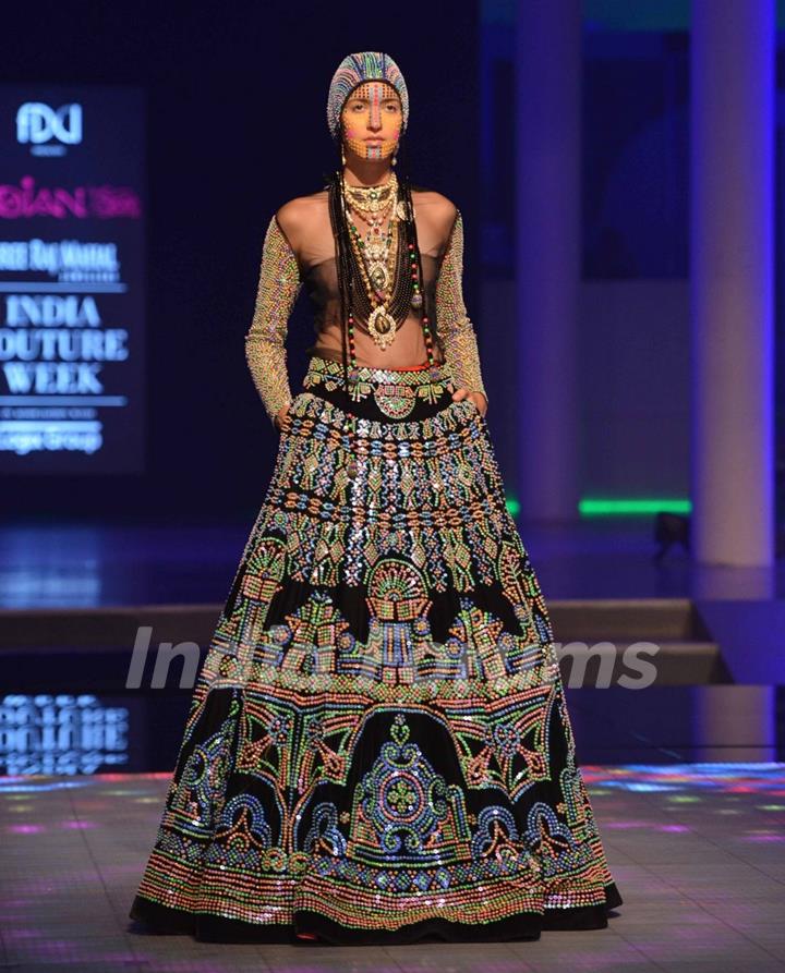 A model walks the ramp at the Indian Couture Week - Day 4