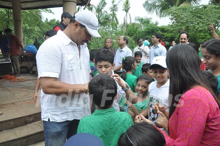 Dayanand Shetty seen giving autographs to his young fans at the Tree Plantation Drive