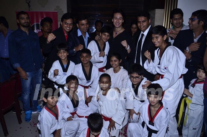 Tiger Shroff poses with the students