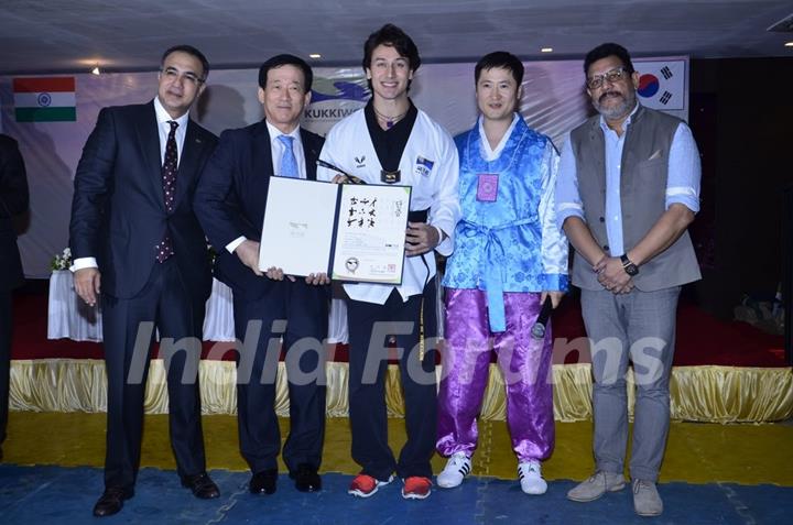 Tiger Shroff receiving his award at the Kukkiwon Award Ceremony