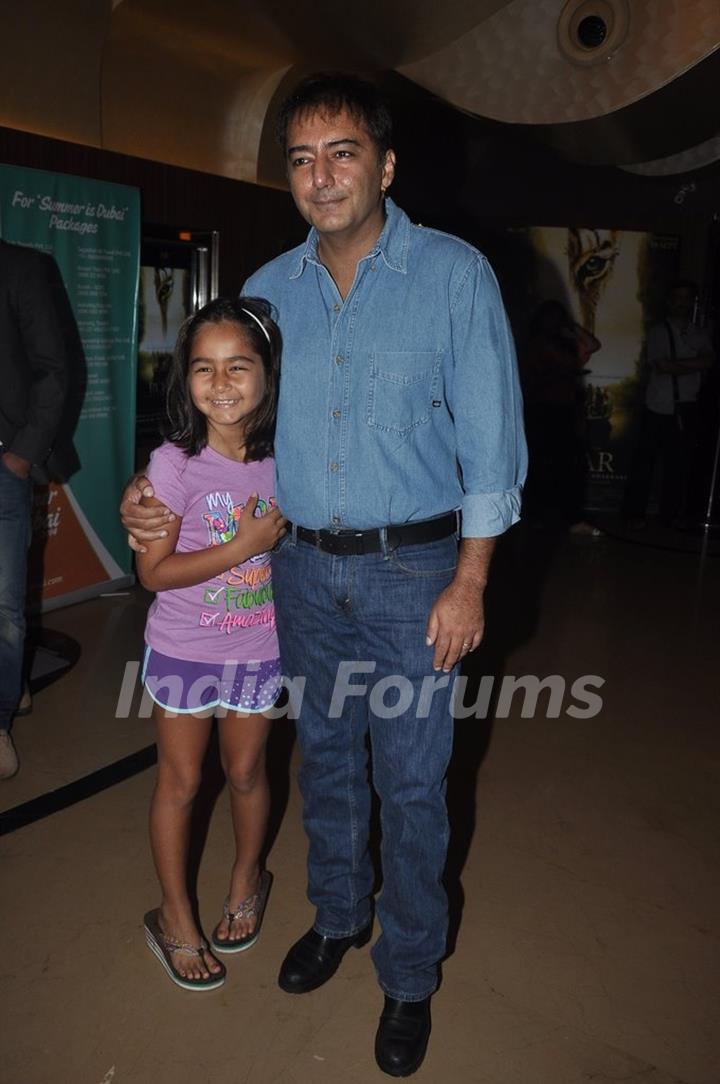 Kamal Saldanah with a child at Roar Film Launch