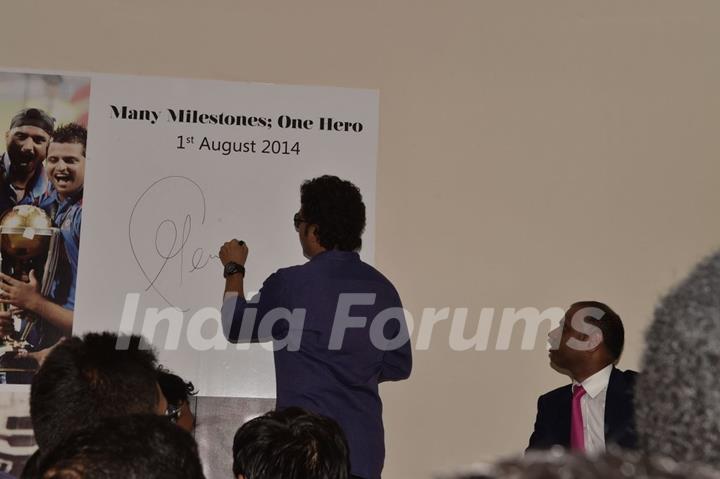 Sachin Tendulkar signs an autograph at the Inauguration of PVP Mall
