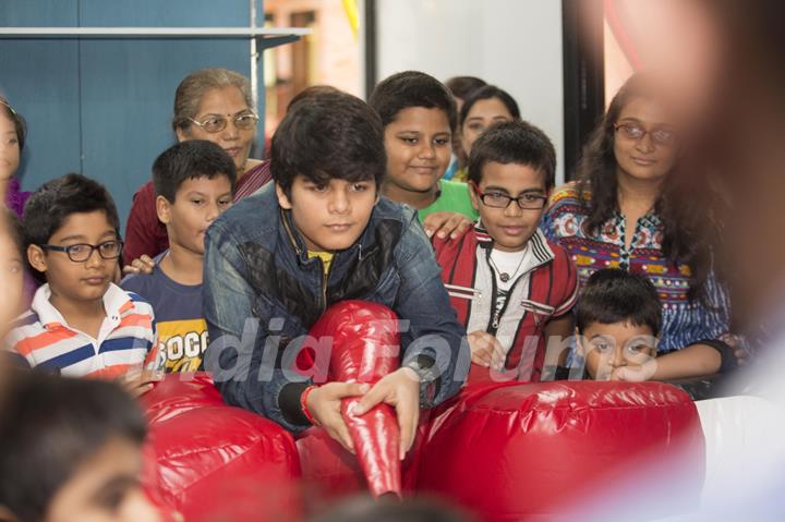 Bhavya Gandhi plays a game of Air Soccer at the Launch of the 10th Planet-Happy Planet with Smilo