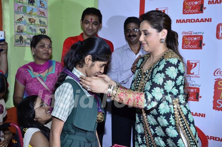 Rani Mukherjee was seen awarding a medal to a student at the Promotion of Mardaani at a Local School