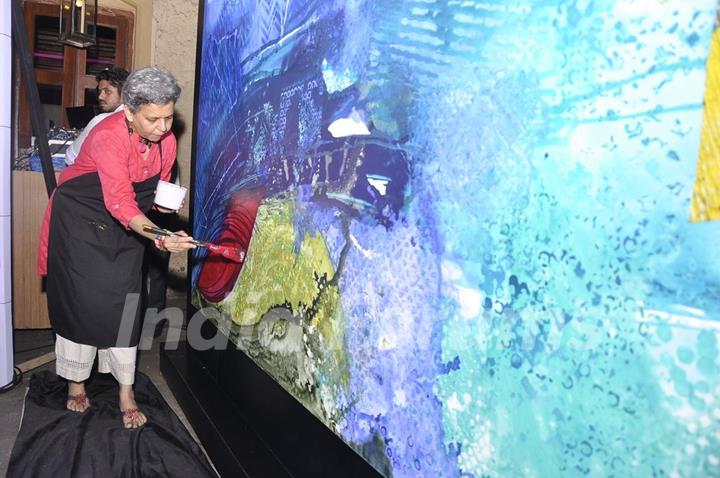 Brinda Miller was seen painting her work of art inspired by the Himalayas