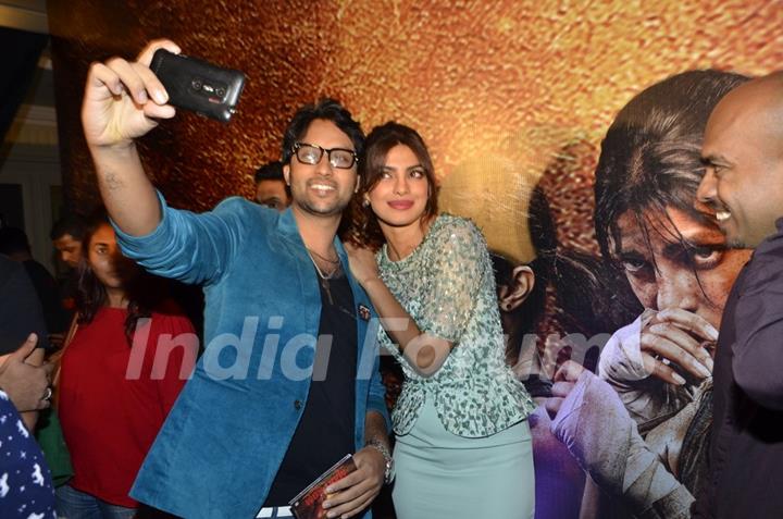 Prianka Chopra poses for a selfie with a fan at the Music Launch of Mary Kom