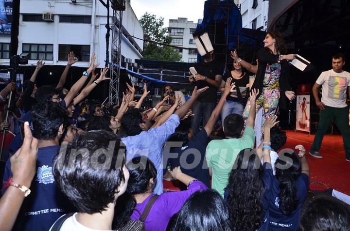 Sonam Kapoor throws some goodies to her fans at the Promotions of Khoobsurat at Mithibai College