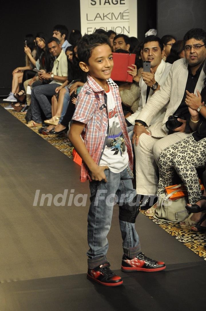 A kid walks the ramp for Barbie at the Lakme Fashion Week Winter/ Festive 2014 Day 2