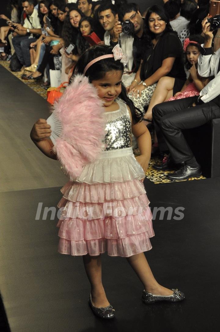 A kid walks the ramp for Barbie at the Lakme Fashion Week Winter/ Festive 2014 Day 2