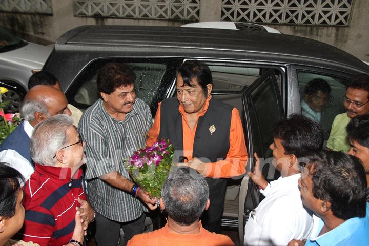 Ashok Pandit greets Manoj Kumar with a bouquet of flowers at the Bhoomipoojan of IFTDA's New Office