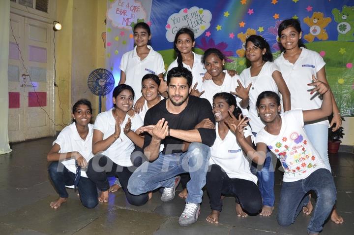 Sidharth Malhotra poses with Kids of Ashray NGO