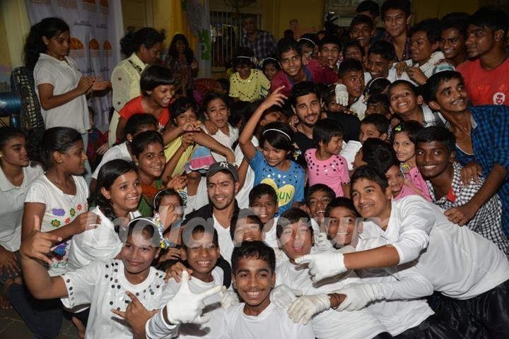 Varun Dhawan and Sidharth Malhotra pose with kids at Ashray Ngo