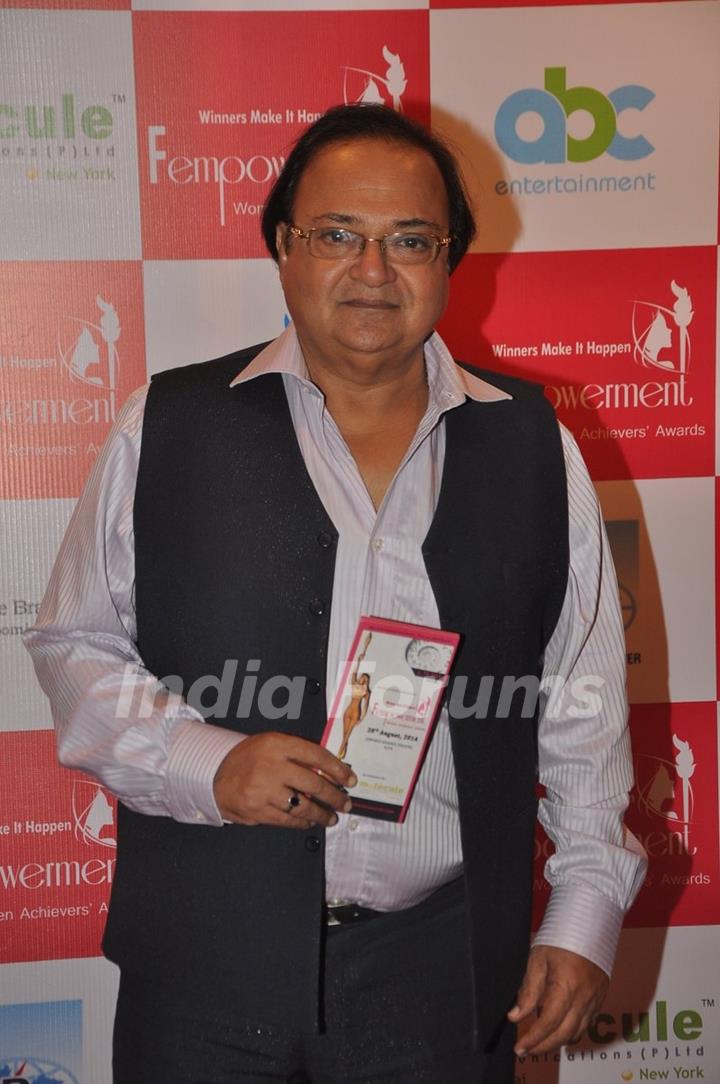 Rakesh Bedi poses for the camera at Fempowerment Awards 2014