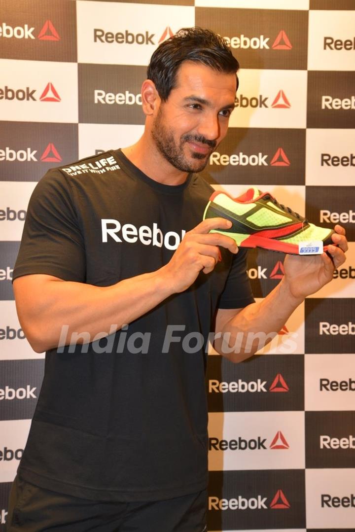 John Abraham showcases a Sport Shoe at the Press Meet of Reebok