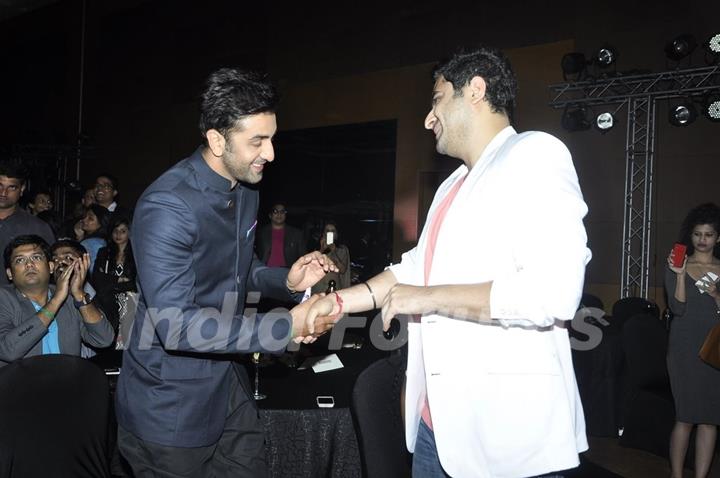 Ranbir Kapoor greets DJ Khushi at the Success Bash of Saavn Mobile App