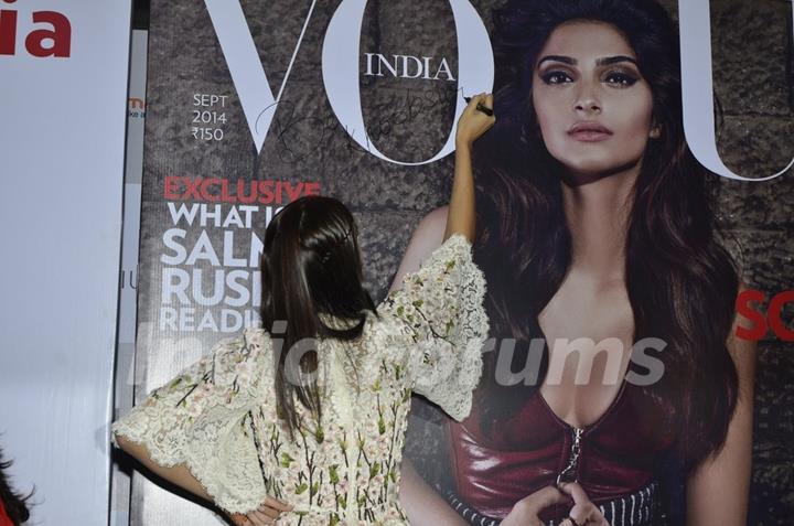 Sonam Kapoor signs an issue of Vogue India, at the Vogue Night Out