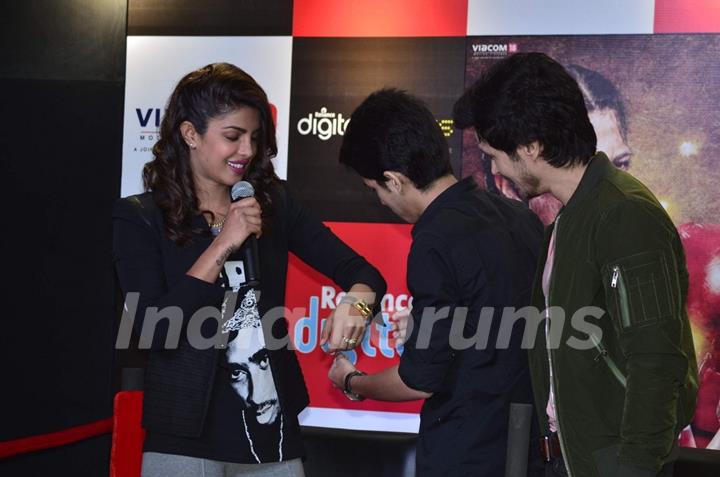 Priyanka Chopra recieves a hand made bracelet by a fan at the Promotions of Mary Kom at Reliance Out