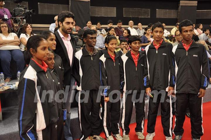 Abhishek Bachchan poses with participants at TT Championship