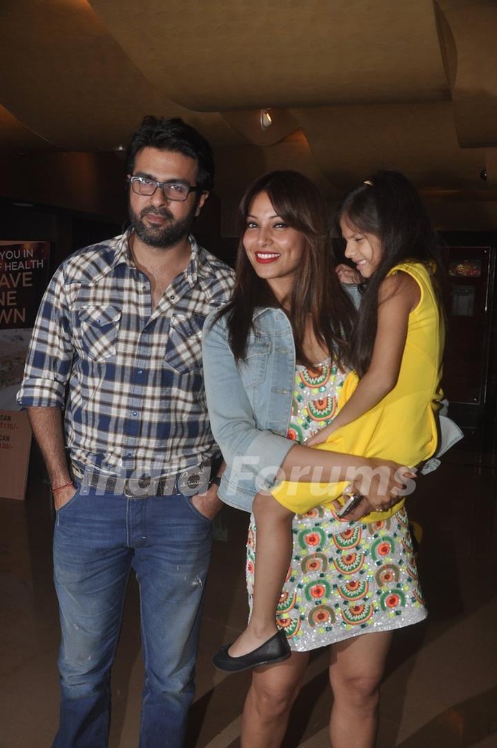 Bipasha Basu and Harman Baweja pose with a kid at the Special Screening of Creature 3D