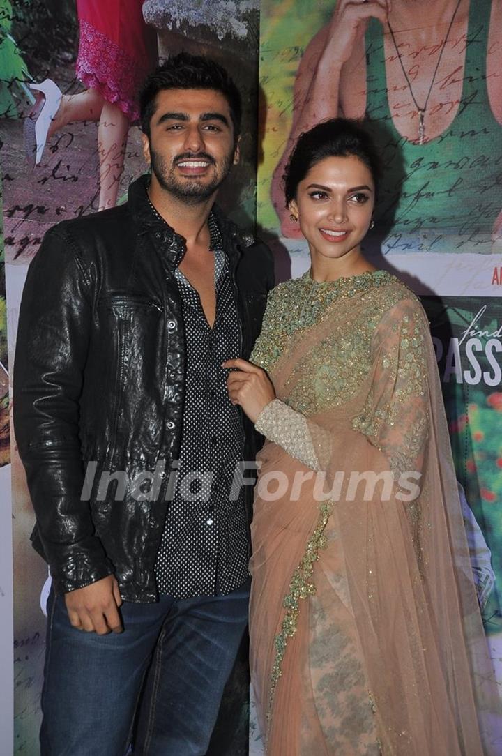 Arjun Kapoor and Deepika Padukone pose for the media at the Success Bash of Finding Fanny