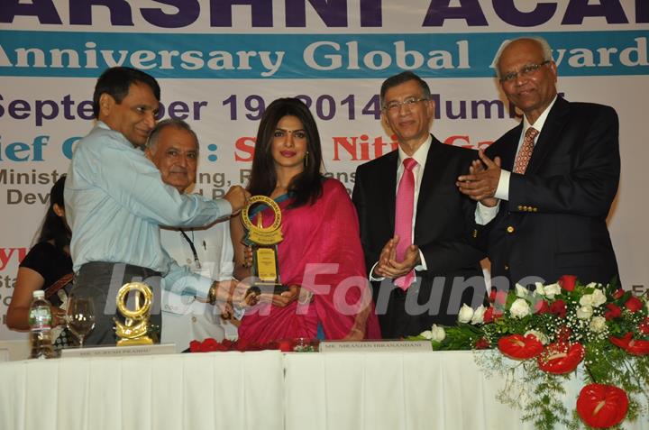 Priyanka Chopra receives a Trophy at Priyadarshini Academy Global Awards 2014