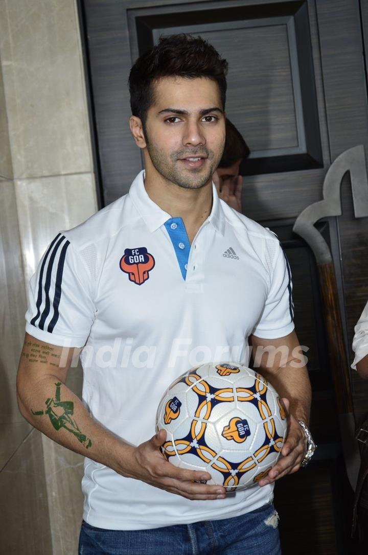 Varun Dhawan poses with the football at FC Goa Official Jersey Launch