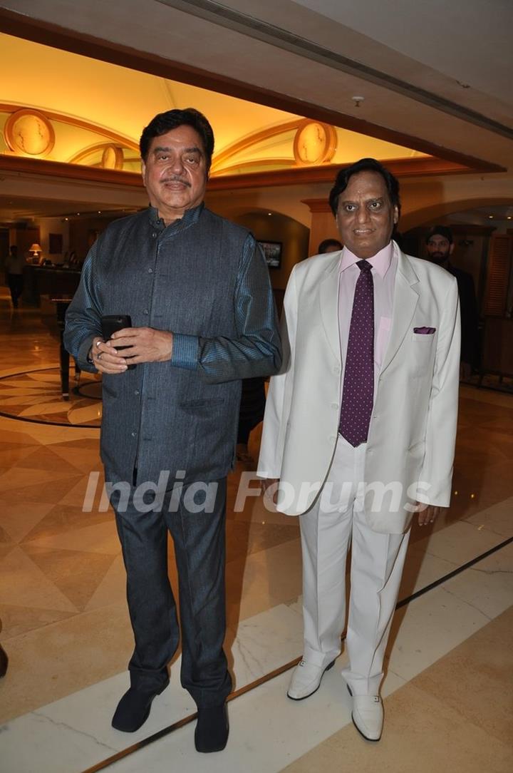 Shatrughan Sinha poses for the media at the bash