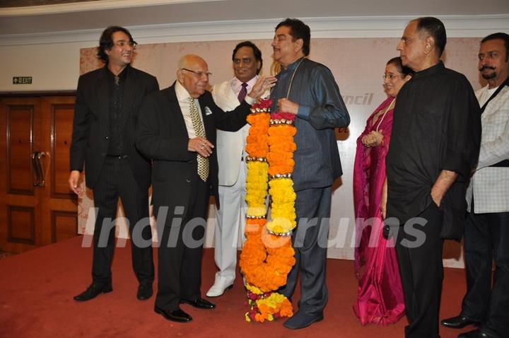 Shatrughan Sinha felicitated with a floral garland at the bash