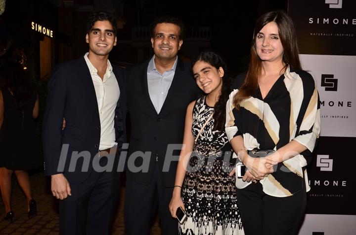 Simone Khan poses with her husband and children at her Store Launch