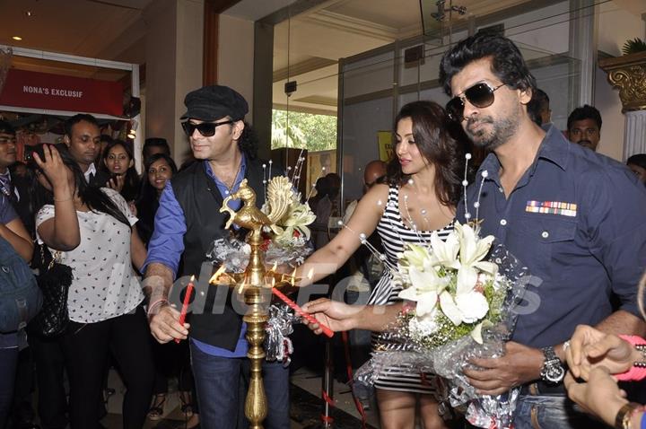 Mohit Chauhan and Nikhil Dwivedi light the lamp at the Launch of Times Glitter